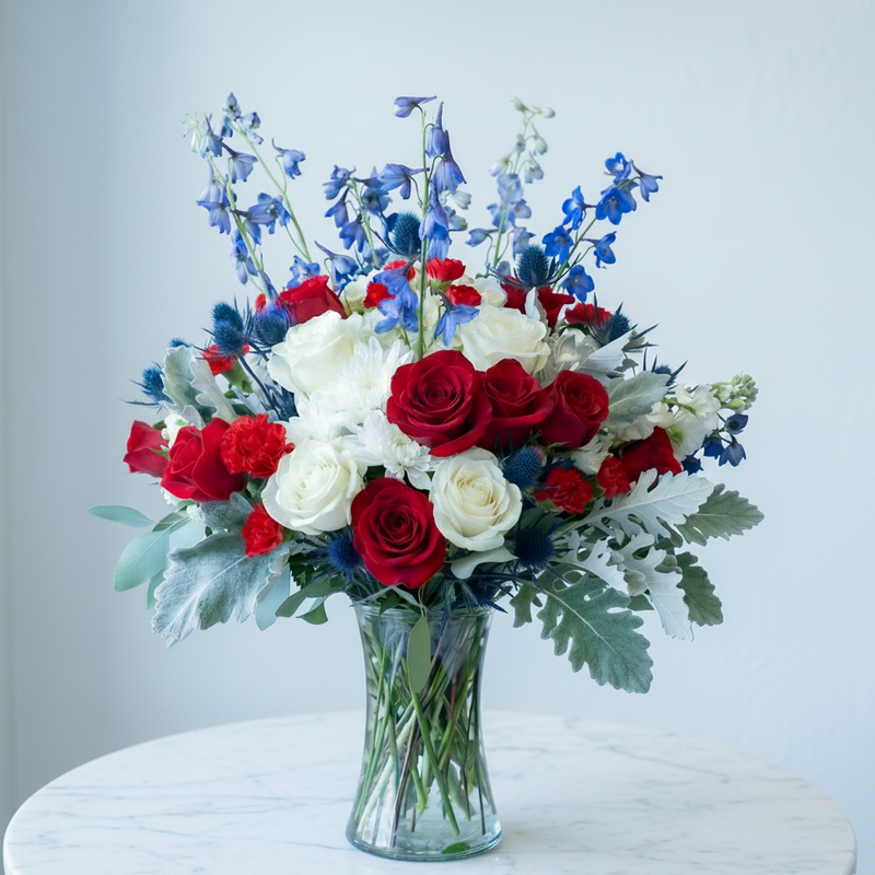 Pink Clover Patriotic Garden Bouquet: vibrant red roses, white mums, blue delphinium, thistle, Los Angeles.