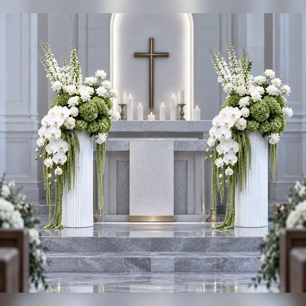 White orchid and hydrangea altar flowers on pedestals at a Los Angeles church funeral service by Pink Clover