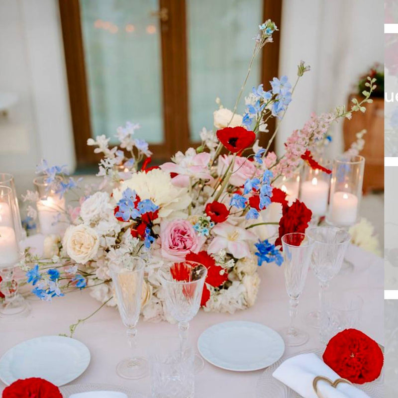 Low patriotic table runner centerpiece with red poppies, pink garden roses, white peonies, and blue delphinium for 4th of July Los Angeles delivery.