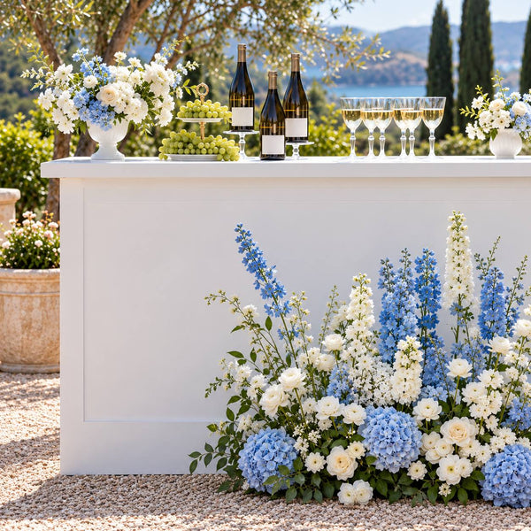 Blue and white delphinium and hydrangea bar installation with wine service at an outdoor event in Los Angeles