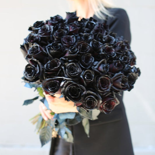 Luxurious black rose bouquet styled for romantic occasions and elegant gift-giving, perfect for luxury floral delivery in Los Angeles