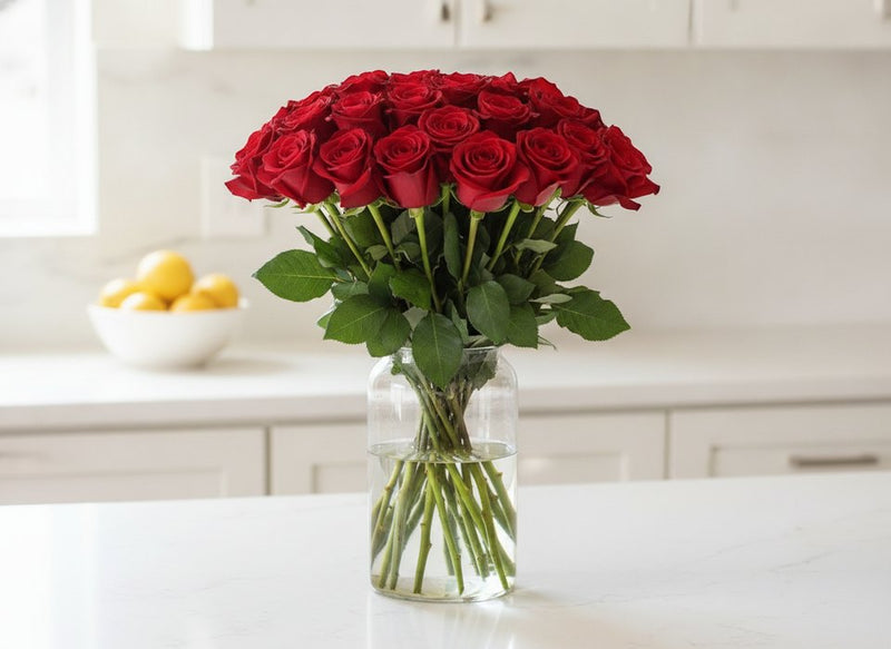 Red Roses bouquet in a glass vase, a cat-safe flower choice, by Pink Clover Florist