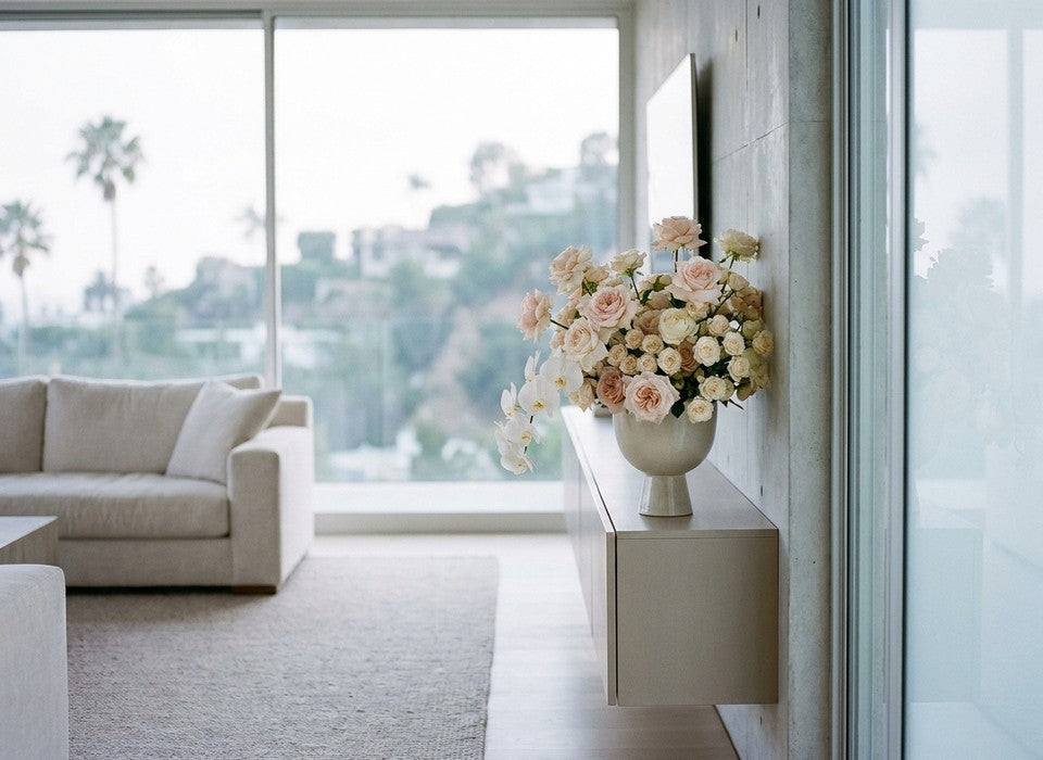 luxury flower arrangement of blush roses and white orchids in a modern Los Angeles home