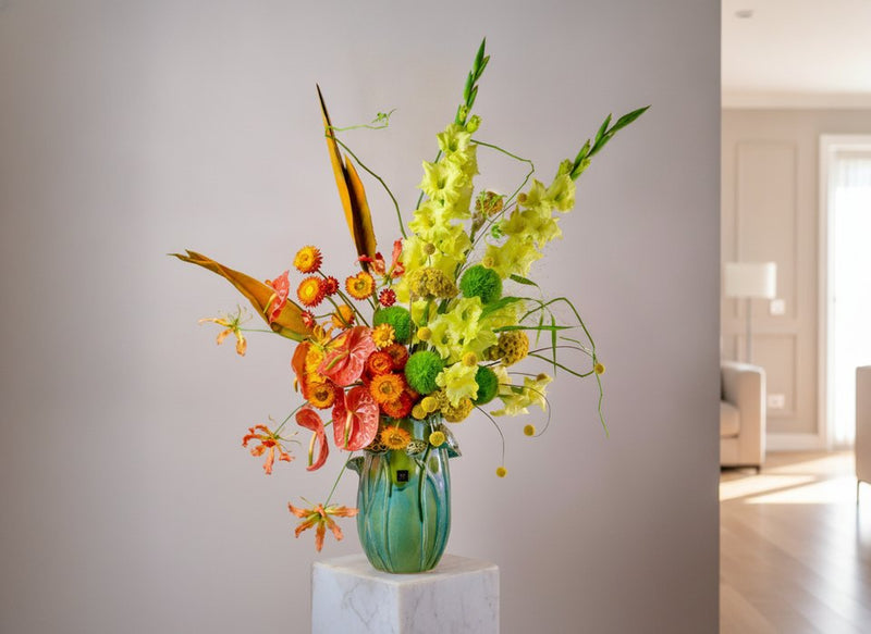 Tropical Sunset arrangement with yellow gladiolus, anthuriums and gloriosa lilies by Pink Clover Florist