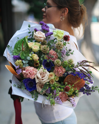 Rustic bouquet of wildflowers and lavender, styled with natural jute ribbon for a meadow-inspired look