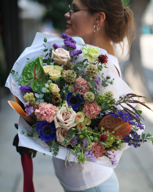 Rustic bouquet of wildflowers and lavender, styled with natural jute ribbon for a meadow-inspired look