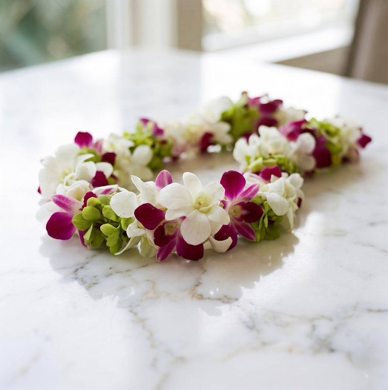 magenta & white orchids with greenery