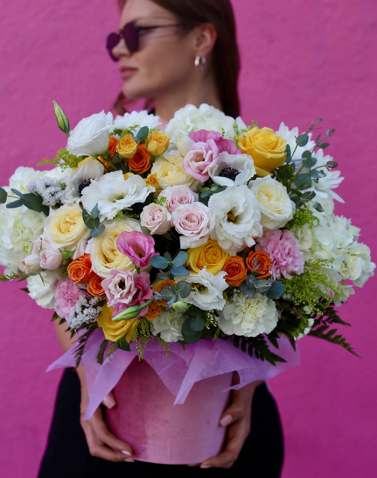 Luxurious April bouquet featuring yellow and orange garden roses, hydrangeas & eucalyptus in a soft velvet box – ideal for premium floral gifting