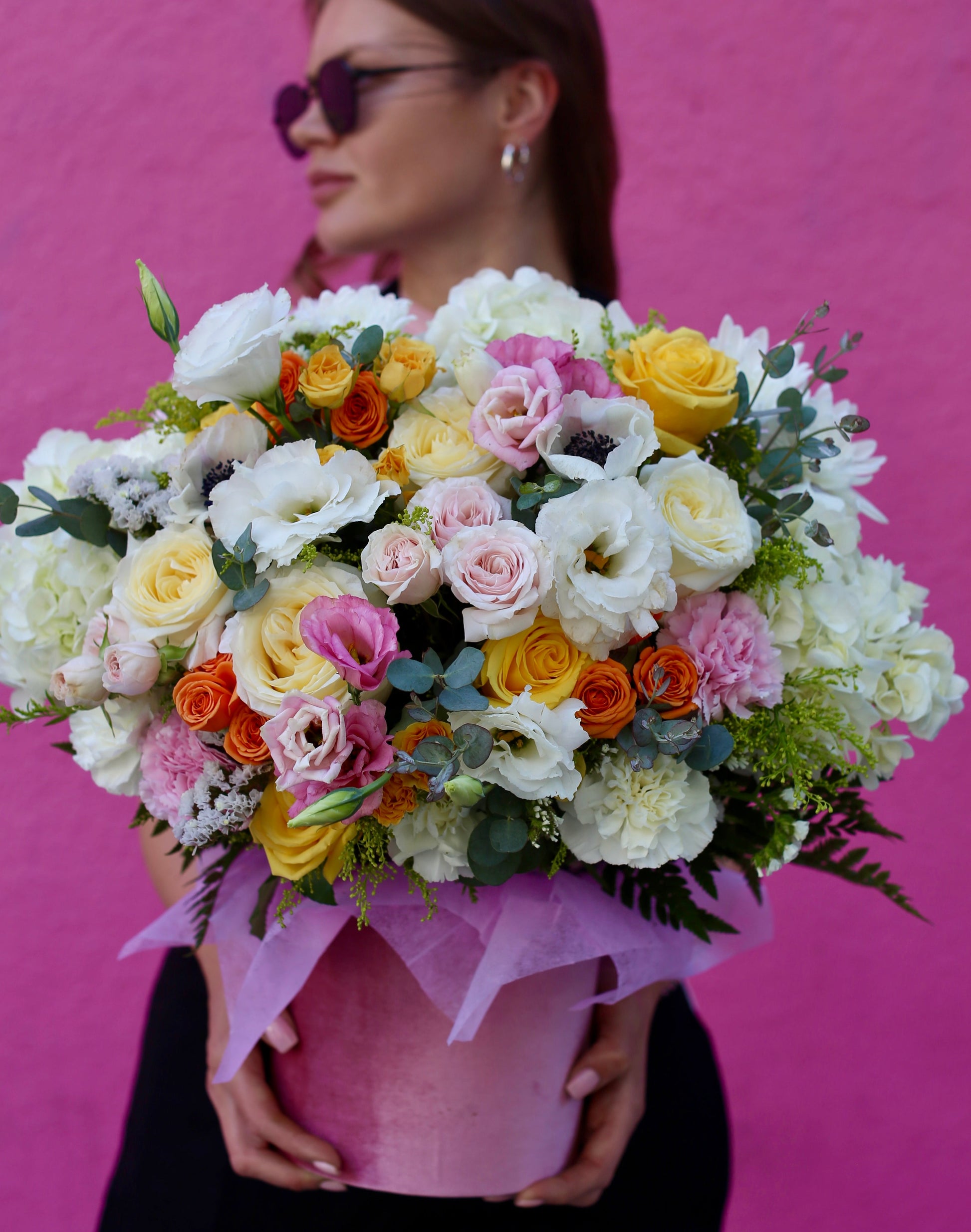 Luxurious April bouquet featuring yellow and orange garden roses, hydrangeas & eucalyptus in a soft velvet box – ideal for premium floral gifting