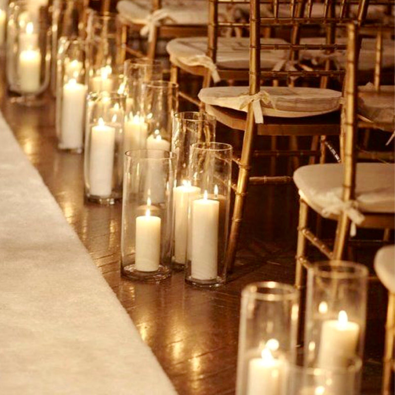 Pink Clover white pillar candles in clear glass cylinders, elegant aisle decor for events, Los Angeles