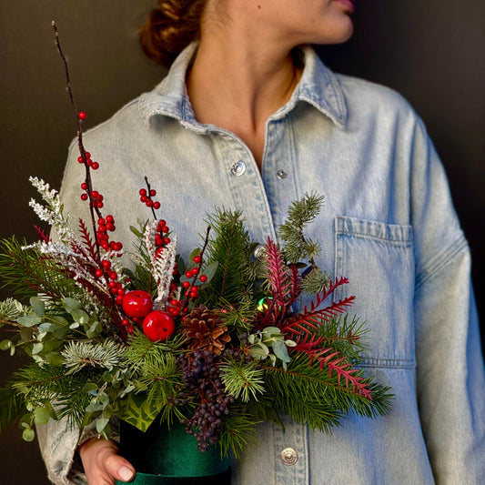 Elegant bouquet of white flowers with frosted green accents, ideal for winter celebrations