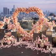 Pink and white rose heart arch, floral arrangements, petals, candles by Pink Clover for luxury proposal decor in Los Angeles.