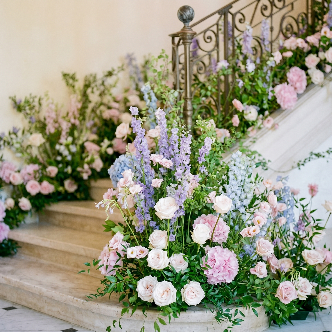 Pink Clover Staircase Floral Installation: Lush pastel pink, blue, lavender roses, hydrangeas, delphin