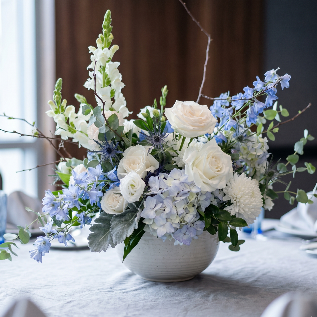 Blue Baby Shower lush organic centerpiece by Pink Clover: white roses, blue hydrangeas, snapdragons