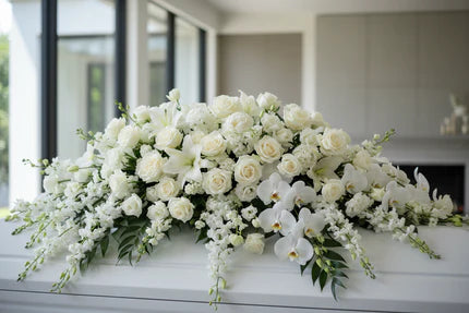 a-cinematic-realistic-close-up-picture-of-premium-large-white-casket-cover-in-a-minimalistic-beverly-hills-villa-blurred-minimal-interior-background-soft-cool-daylight-luxury-floral-p.webp