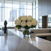 Pink Clover's lush white rose bouquet in glass vase, elegant reception flowers subscription Los Angeles.
