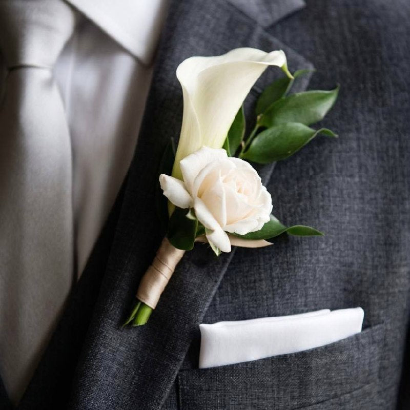Calla Lily & Rose Boutonnière worn on a suit lapel — Los Angeles wedding florist