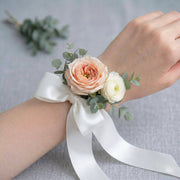 Peach Rose & Ranunculus Wrist Corsage worn on the wrist — Los Angeles wedding florist