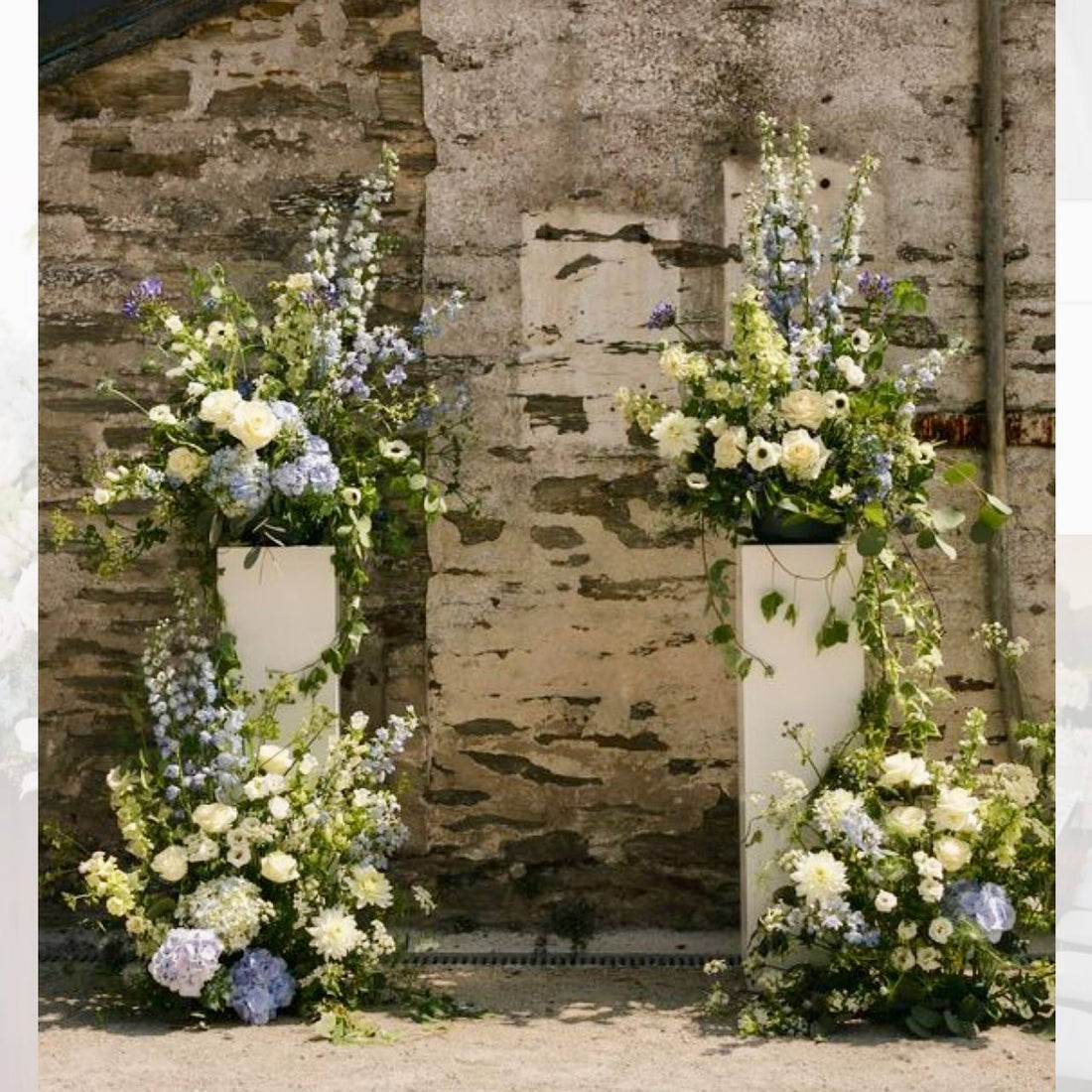 Blue and white pedestal floral set with delphinium and roses for Los Angeles ceremonies