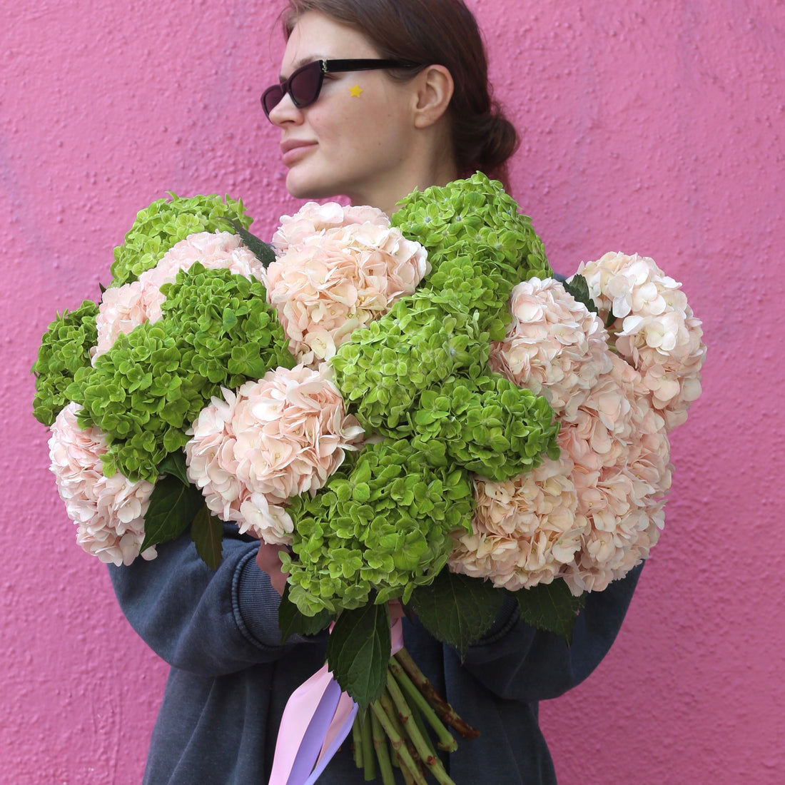 Elegant bouquet of blush flowers with mint accents, ideal for serene celebrations