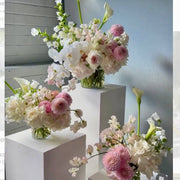 Blush and orchid pedestal collection with dahlias and calla lilies for luxury Los Angeles weddings