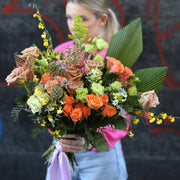 Vibrant Bouquet Brightness floral arrangement featuring yellow roses, carnations, and alstroemeria in a joyful, colorful composition