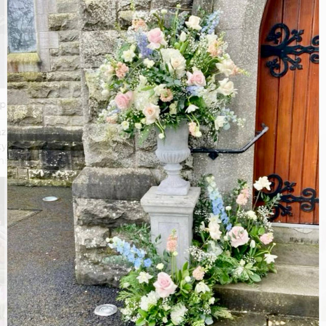 Church entrance pedestal floral set with pink roses and delphinium for Los Angeles ceremonies