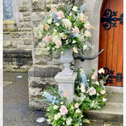 Church entrance pedestal floral set with pink roses and delphinium for Los Angeles ceremonies