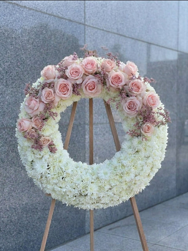 Pink rose sympathy wreath on easel, Los Angeles funeral flower delivery