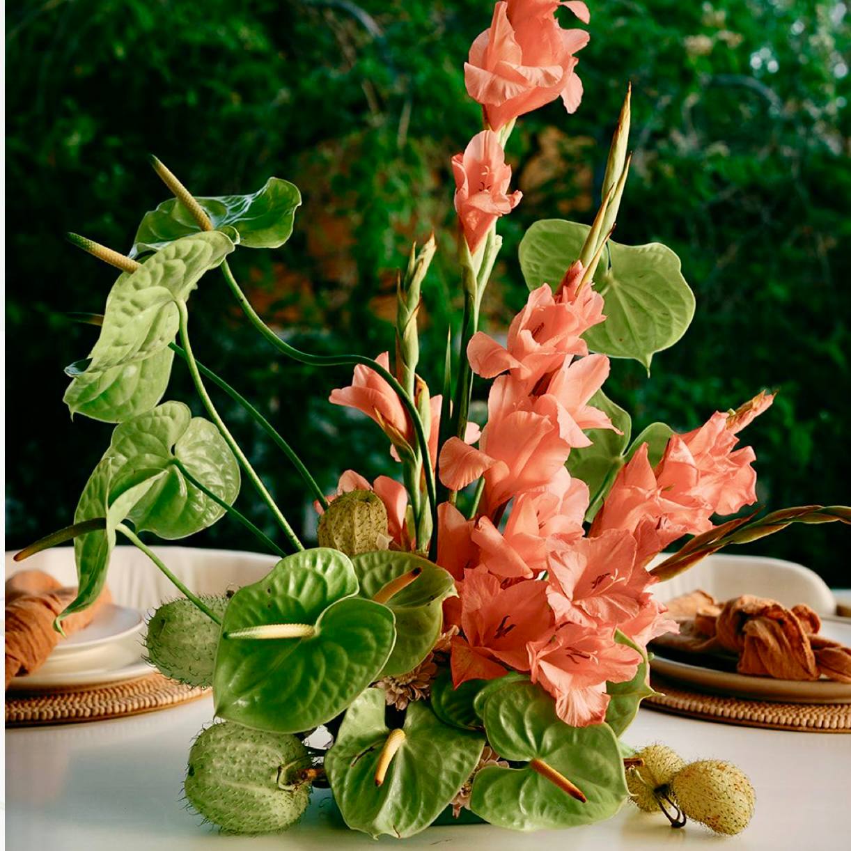 Coral gladiolus and green anthurium tropical centerpiece for events and dining by Pink Clover Flowers Los Angeles