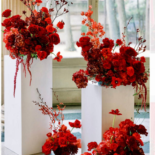 Dramatic red pedestal collection with roses and hydrangeas for glamorous Los Angeles events