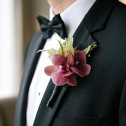 Orchid Boutonnière worn on a suit lapel — Los Angeles wedding florist