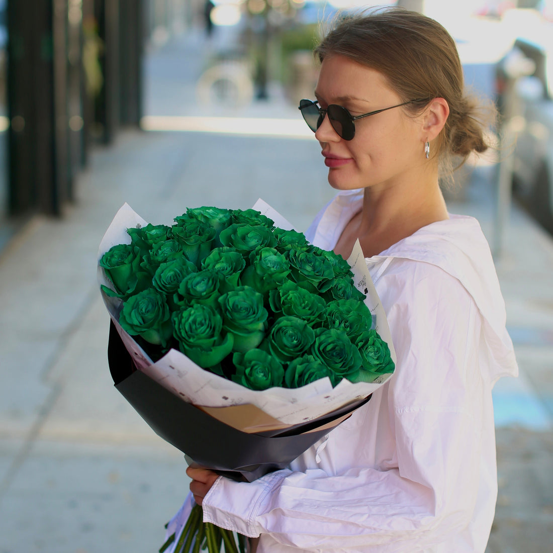 Luxurious emerald-green bouquet with anthuriums and tropical foliage, styled for modern elegance