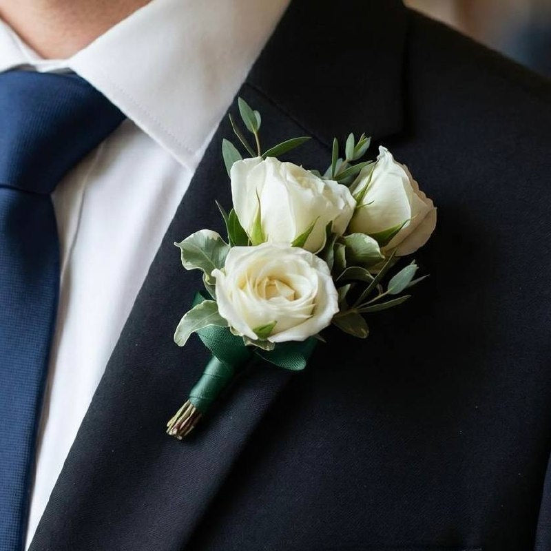 White Rose Boutonnière worn on a suit lapel — Los Angeles wedding florist