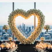 Twelve floating candles in glass cylinders with water for Los Angeles proposal decor.