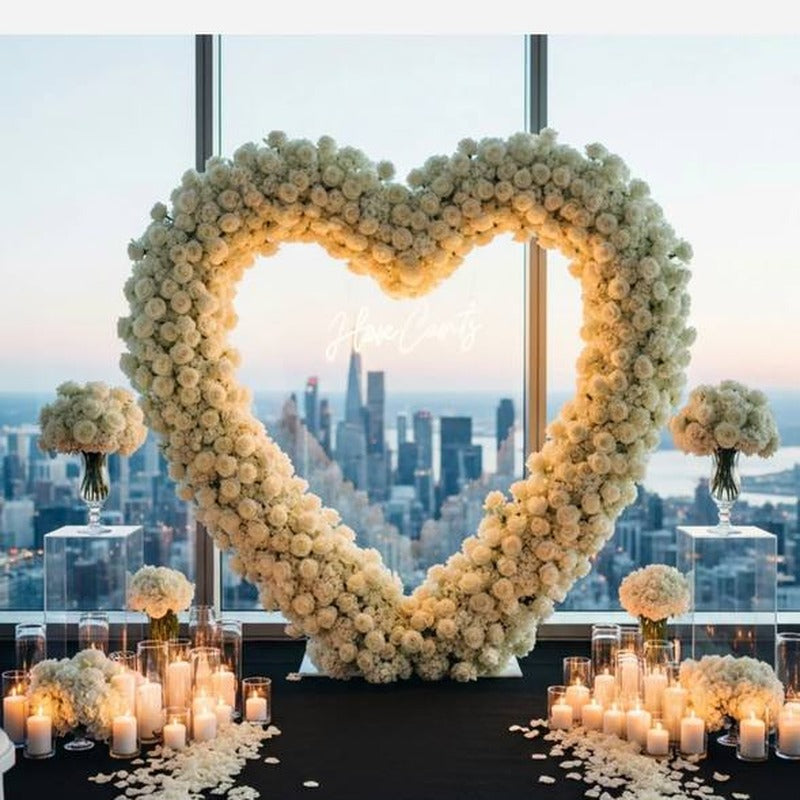 Twelve floating candles in glass cylinders with water for Los Angeles proposal decor.