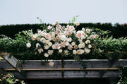 Artisan-crafted Flower Clouds Arch featuring cascading blooms and lush greenery for luxury weddings