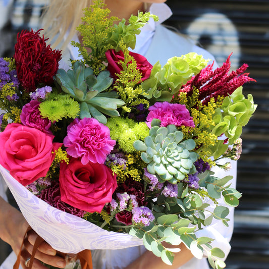 Elegant Laura bouquet featuring roses and succulents beautifully arranged for premium floral delivery