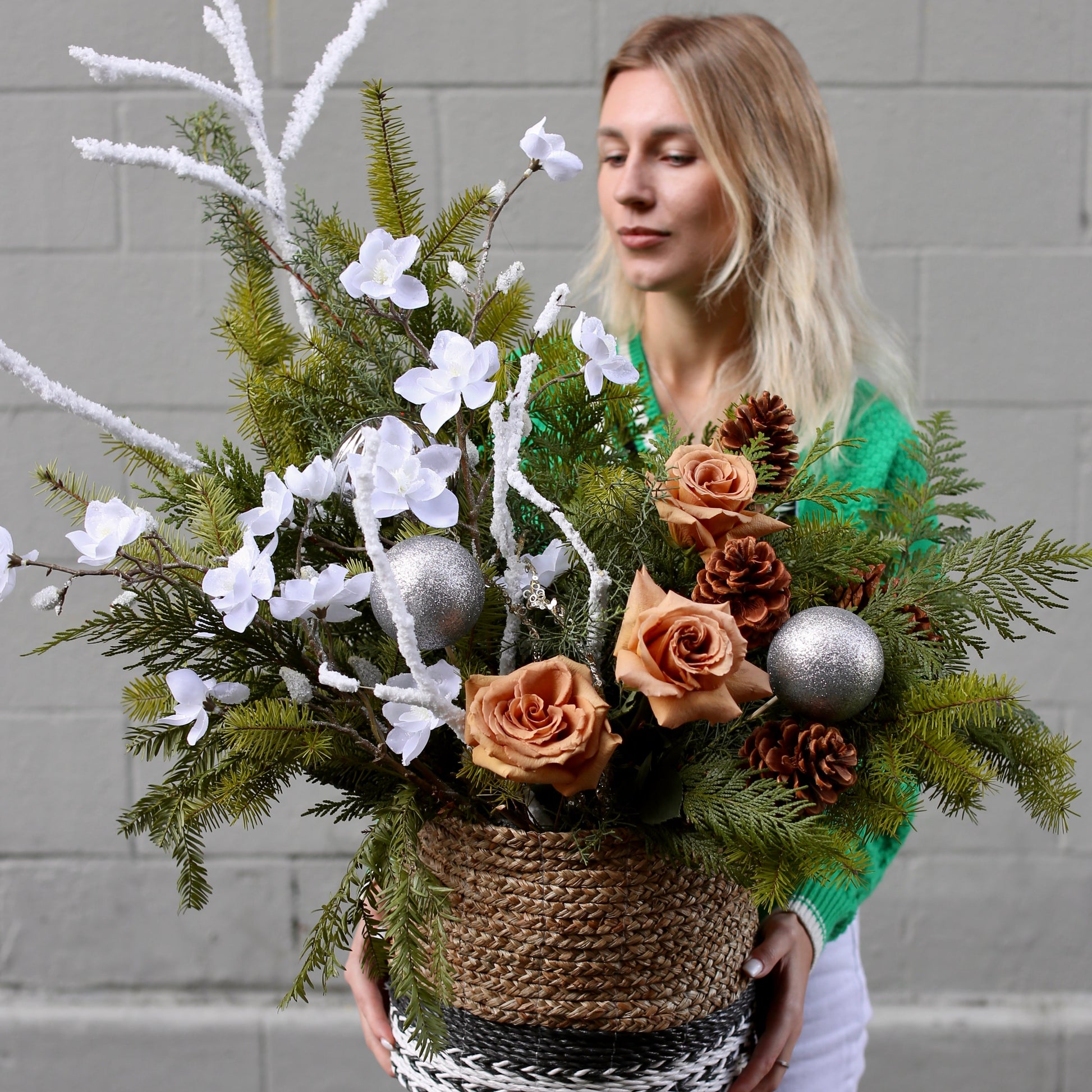 Festive floral Christmas tree design featuring soft blooms and greenery, perfect for seasonal decor and gifting