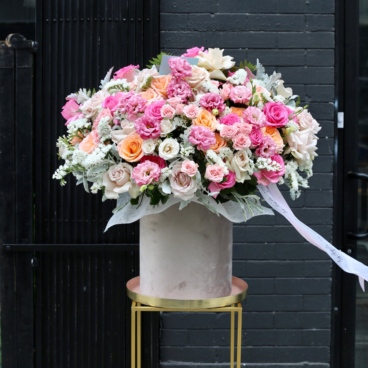 Light and airy hand-tied bouquet with a cloud-like shape, freshly delivered and beautifully wrapped in minimalist packaging.