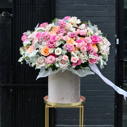 Light and airy hand-tied bouquet with a cloud-like shape, freshly delivered and beautifully wrapped in minimalist packaging.
