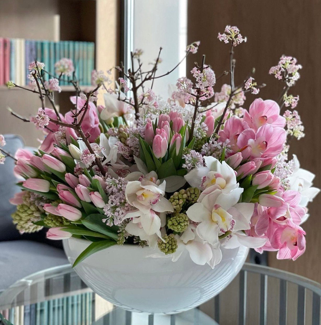 Elegant Mother’s Day floral arrangement featuring pink roses, carnations, and alstroemeria in a modern vase