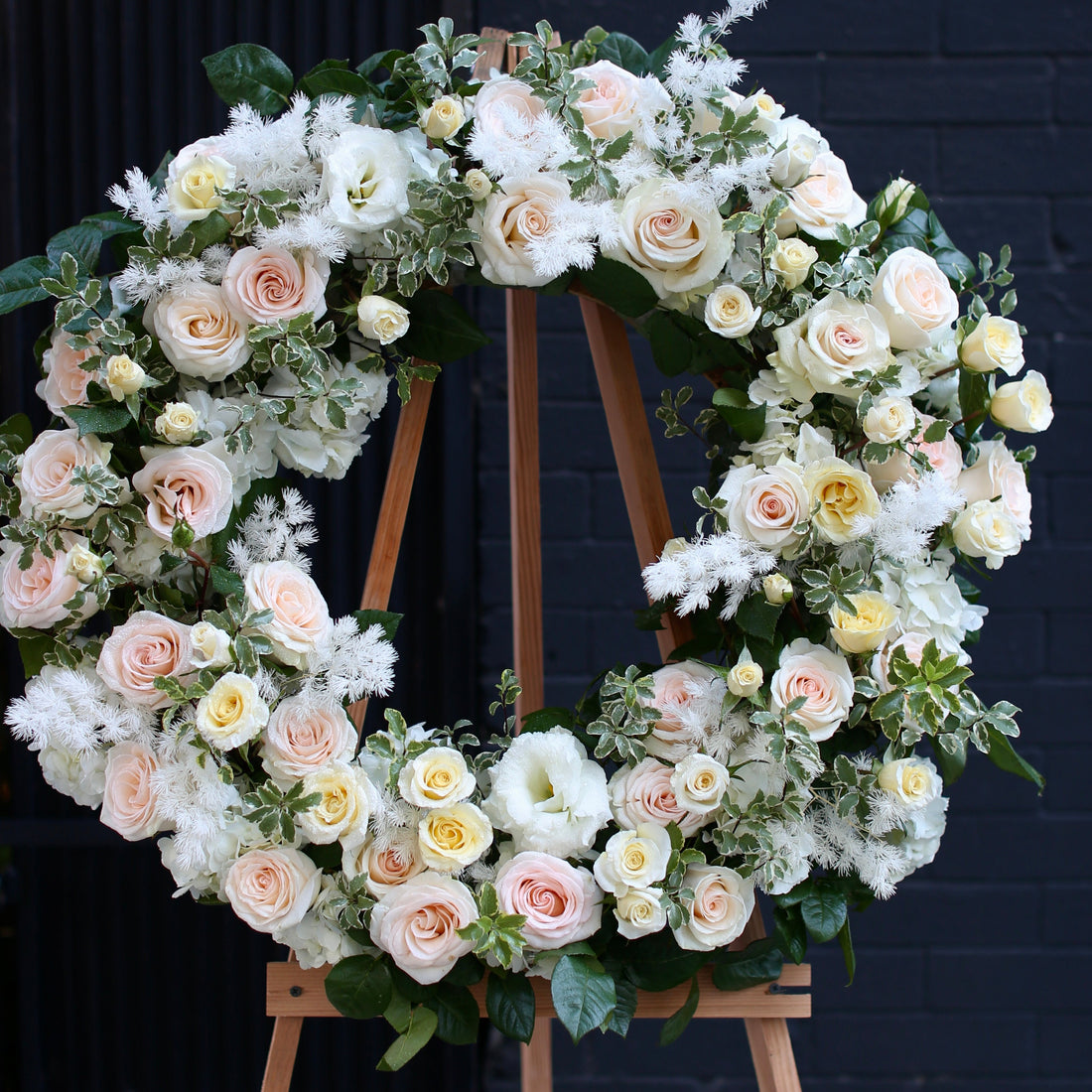 Loving Tribute bouquet from Pink Clover LA, featuring delicate blooms and green accents