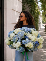 Majestic Skies blue and white hydrangea bouquet held on a Los Angeles street — Pink Clover