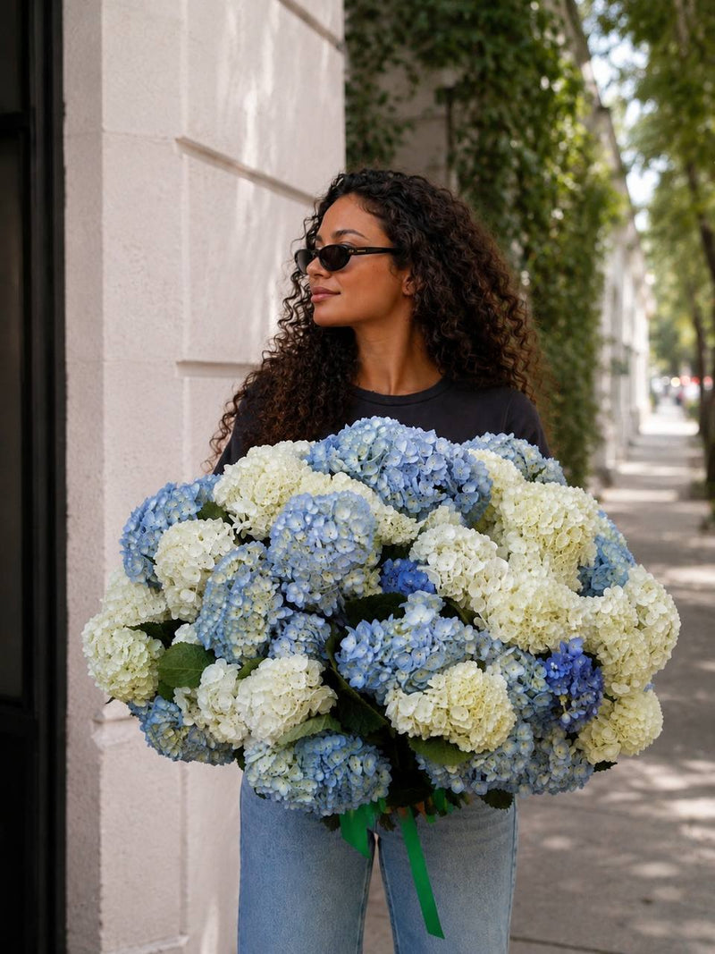 Majestic Skies blue and white hydrangea bouquet held on a Los Angeles street — Pink Clover