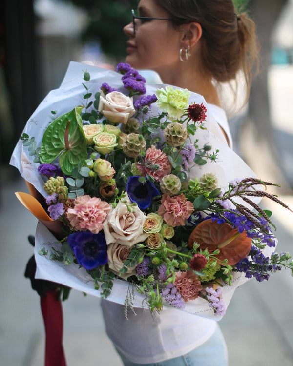 Rustic bouquet of wildflowers and lavender, styled with natural jute ribbon for a meadow-inspired look