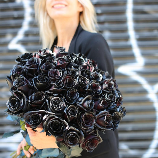 Dramatic Obsidian bouquet featuring black roses with subtle red undertones, beautifully arranged for premium floral delivery