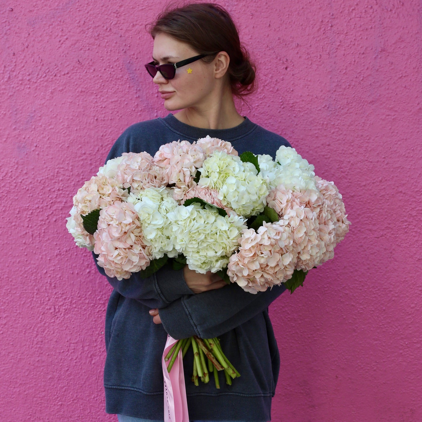 Elegant bouquet of pink roses with lush green accents, ideal for romantic celebrations