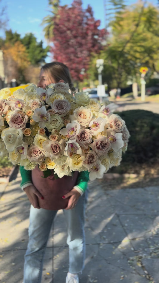 Premium white flower arrangement showcasing pristine blooms in a minimalist yet luxurious presentation