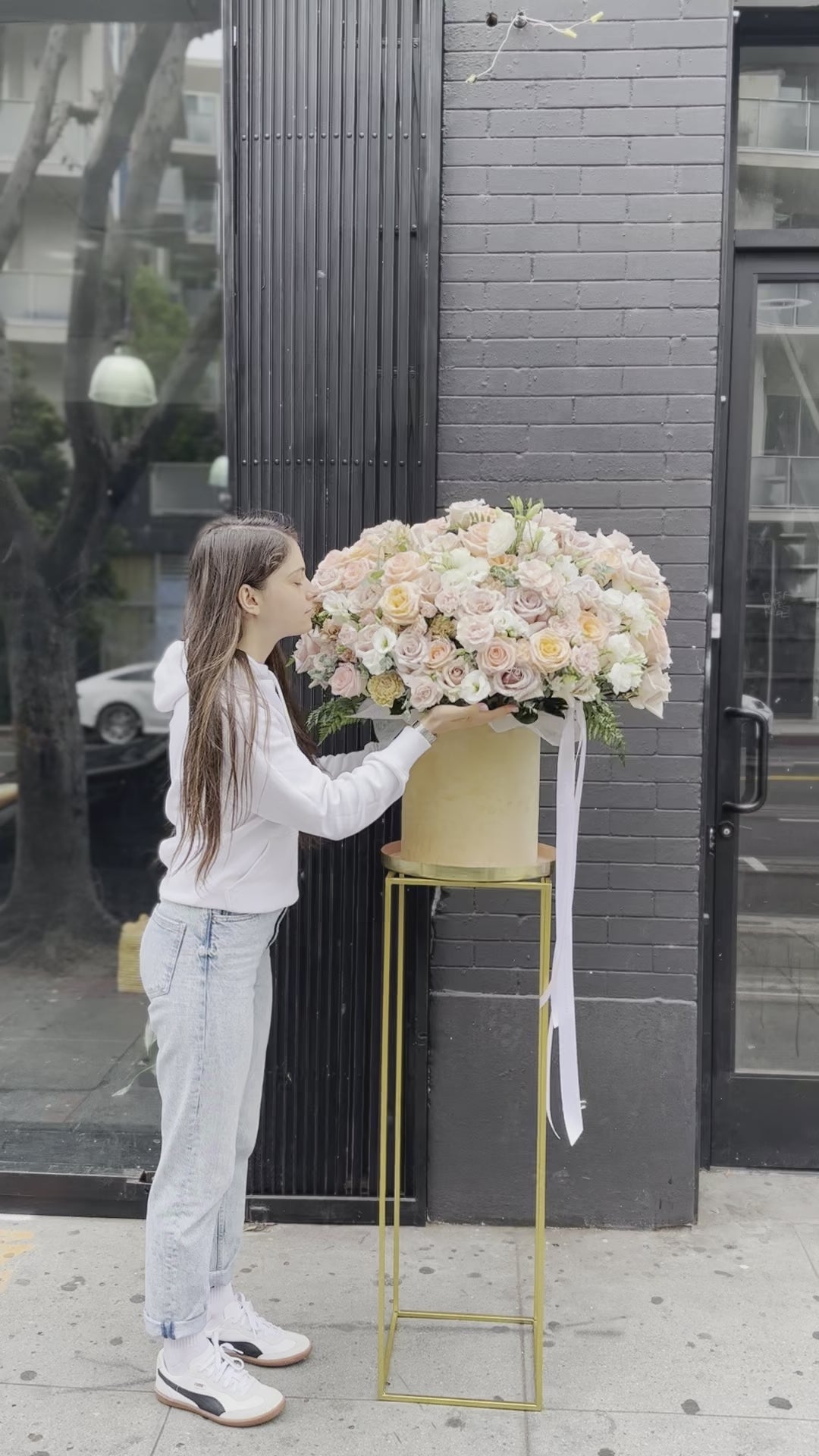 Soft pastel floral arrangement in warm peach and ivory tones, ideal for romantic occasions and special celebrations.
